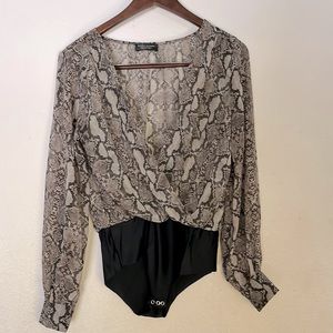 Zara’s collection Animal printed long sleeve bodysuit.